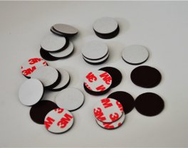 Rubber magnetic disc with self-adhesive